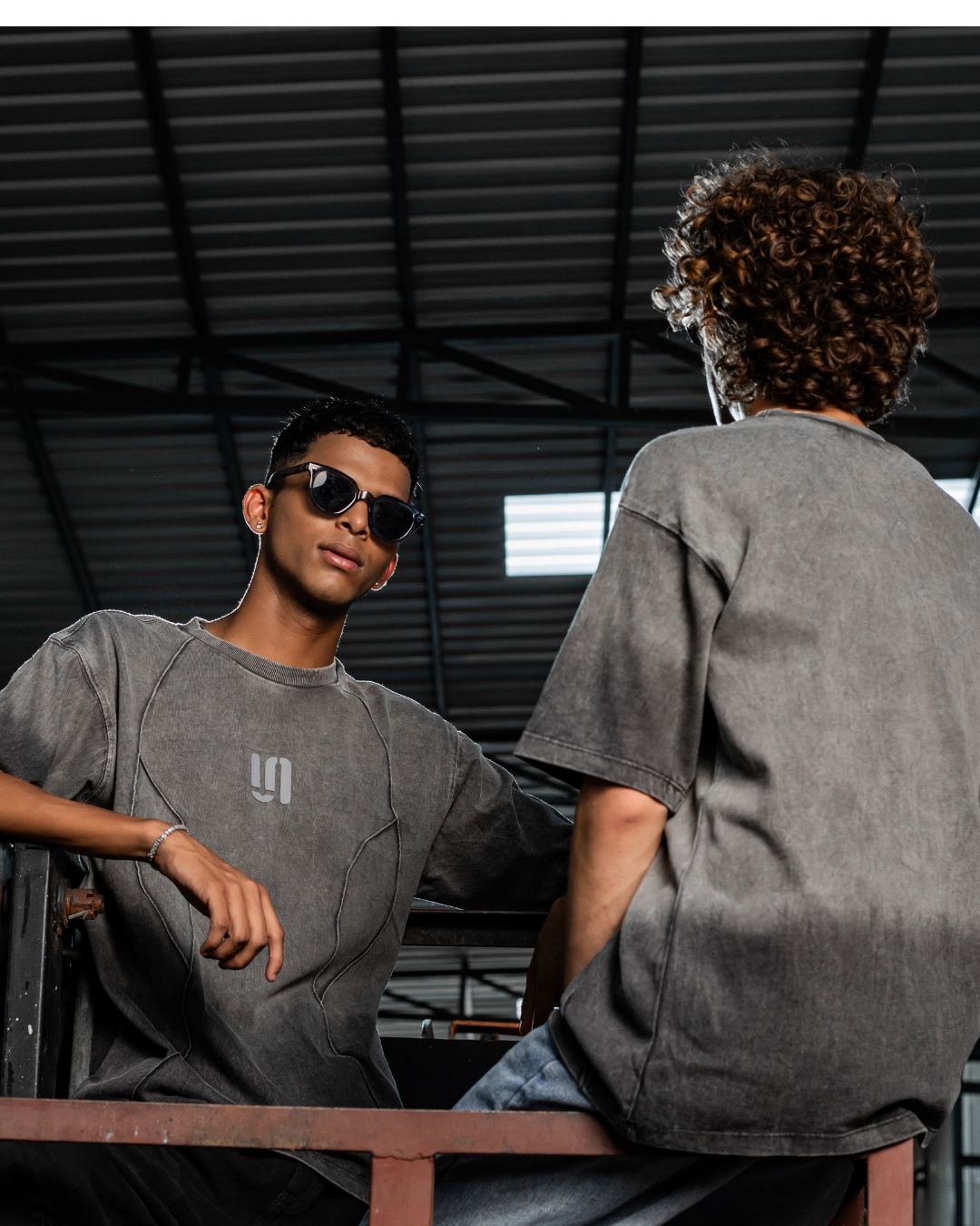 Grey threadbare crew-neck t-shirt with short sleeves and small chest logo