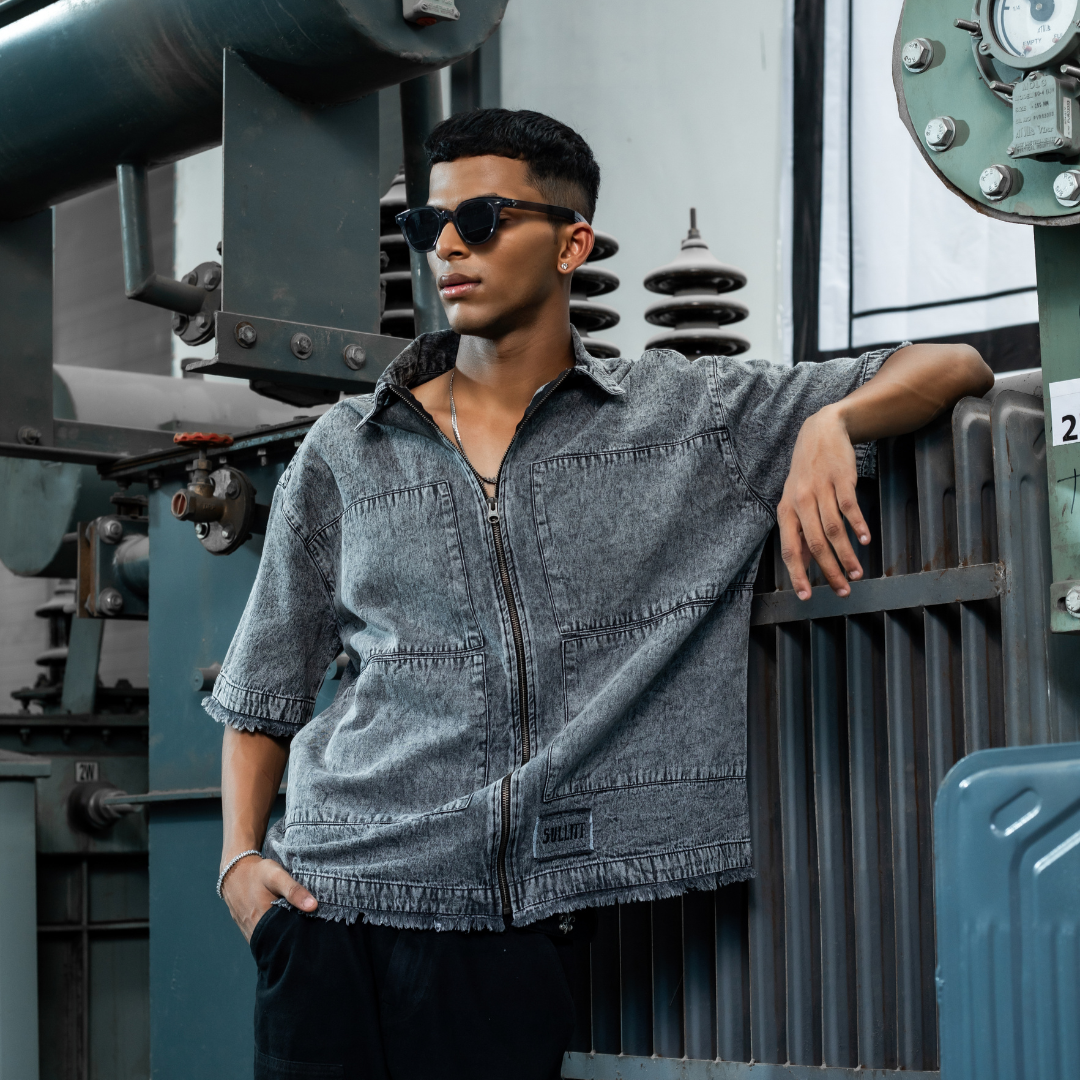 Blue-gray denim zip-front jacket with chest pockets and short sleeves
