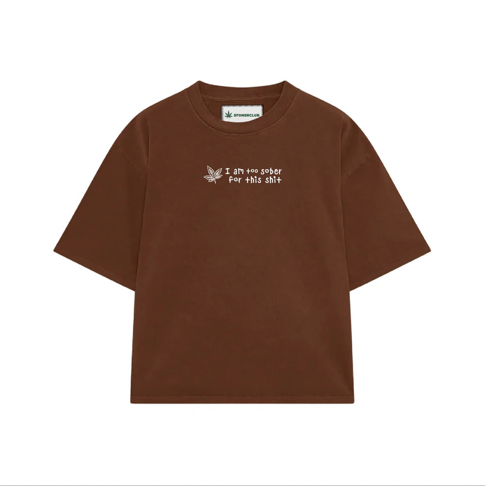 Brown short-sleeve T-shirt with front cannabis-leaf graphic and small text