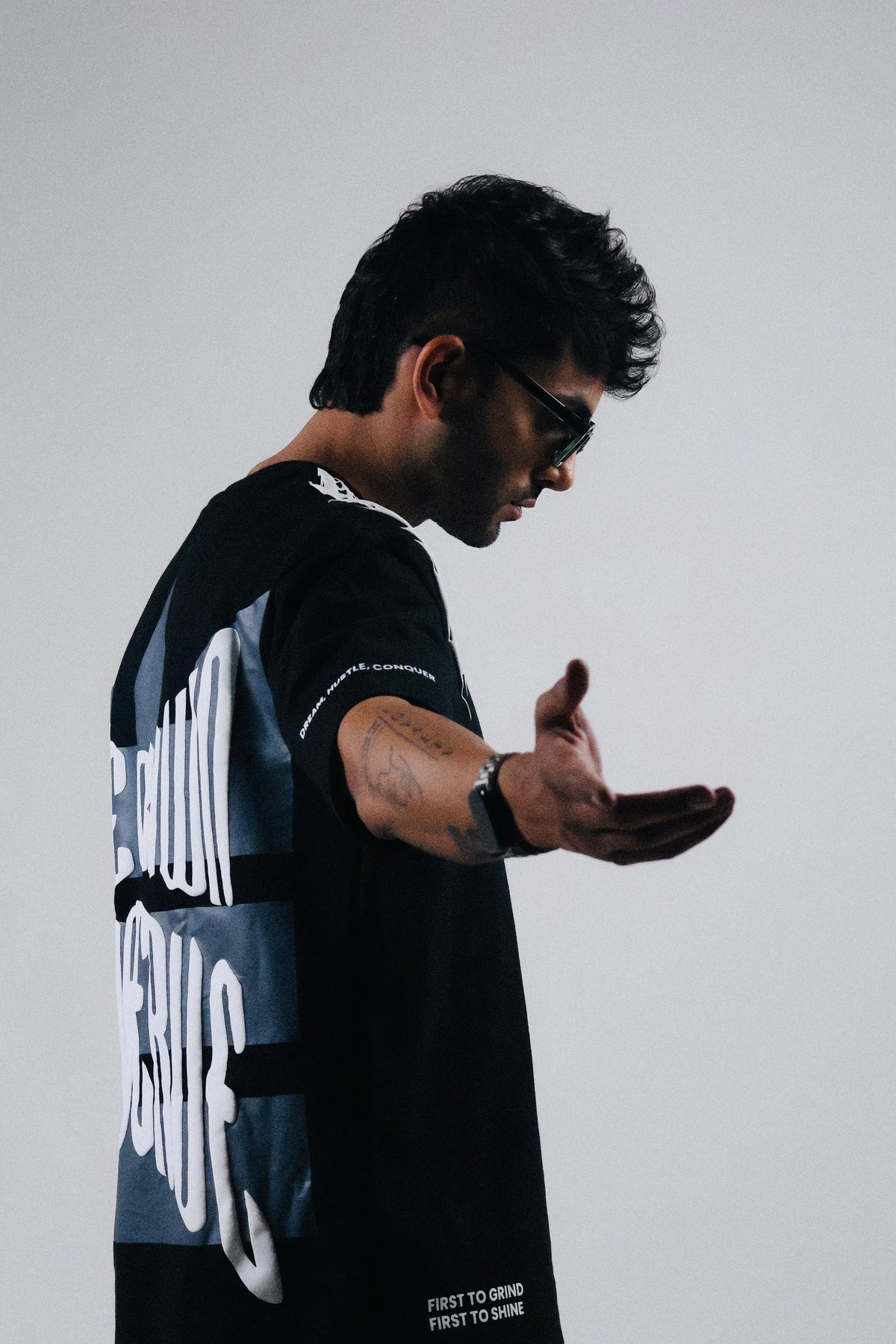 Oversized black T-shirt with partial white back and sleeve graphic