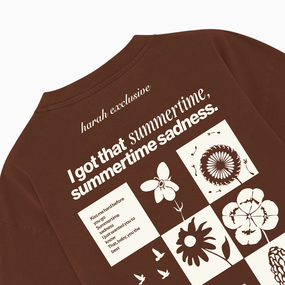 Brown T-shirt back close-up with quote and floral graphic print