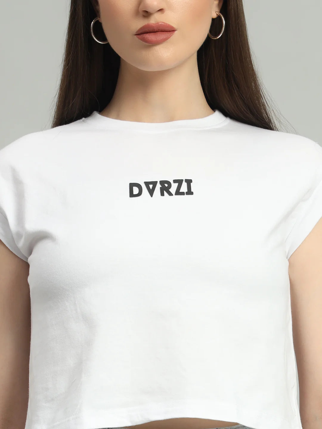 White crew-neck cropped tee with DVRZI logo text, short sleeves