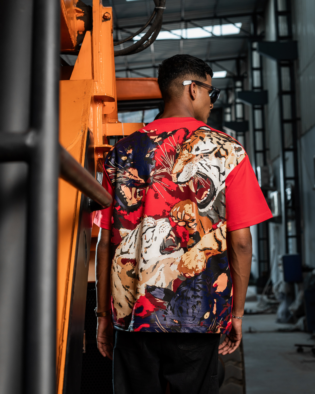 Red crew-neck T-shirt with large animal camo graphic on back