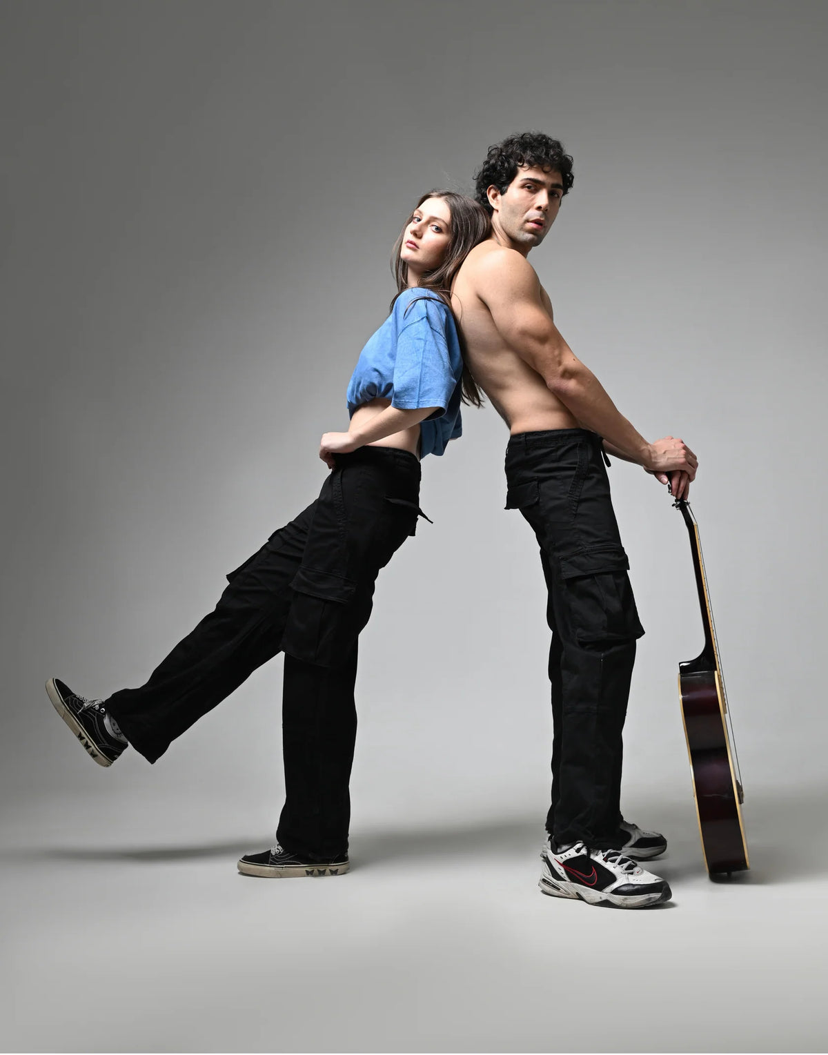 Black cargo pants with side cargo pockets, drawstring waist, and roomy straight-leg cut