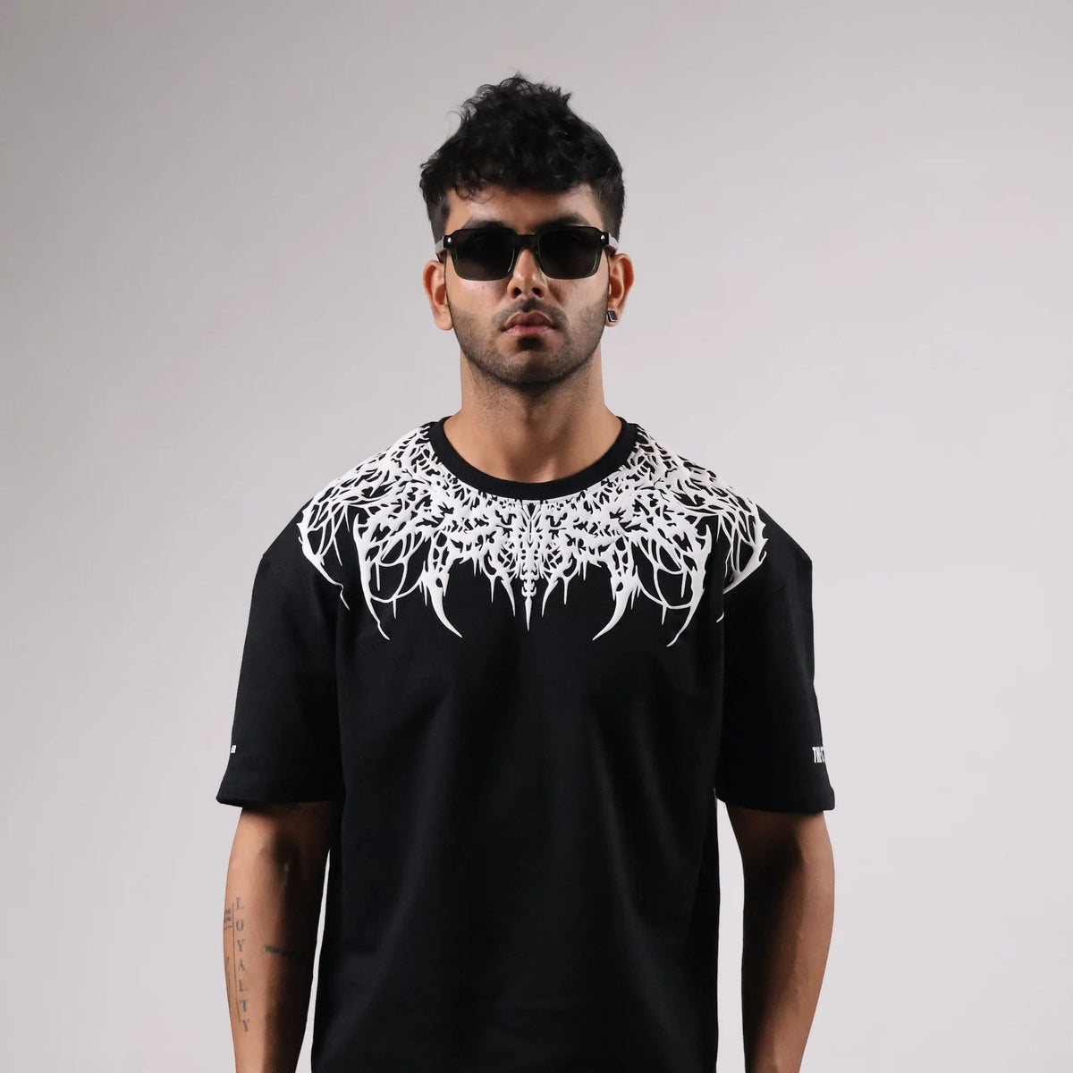 Oversized black T-shirt with white dripping crown graphic on chest