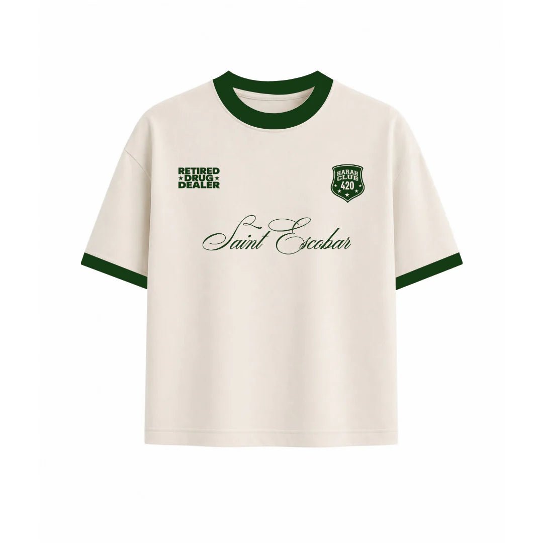 Cropped ringer T-shirt, cream with green crew neck and sleeve trim; front graphic