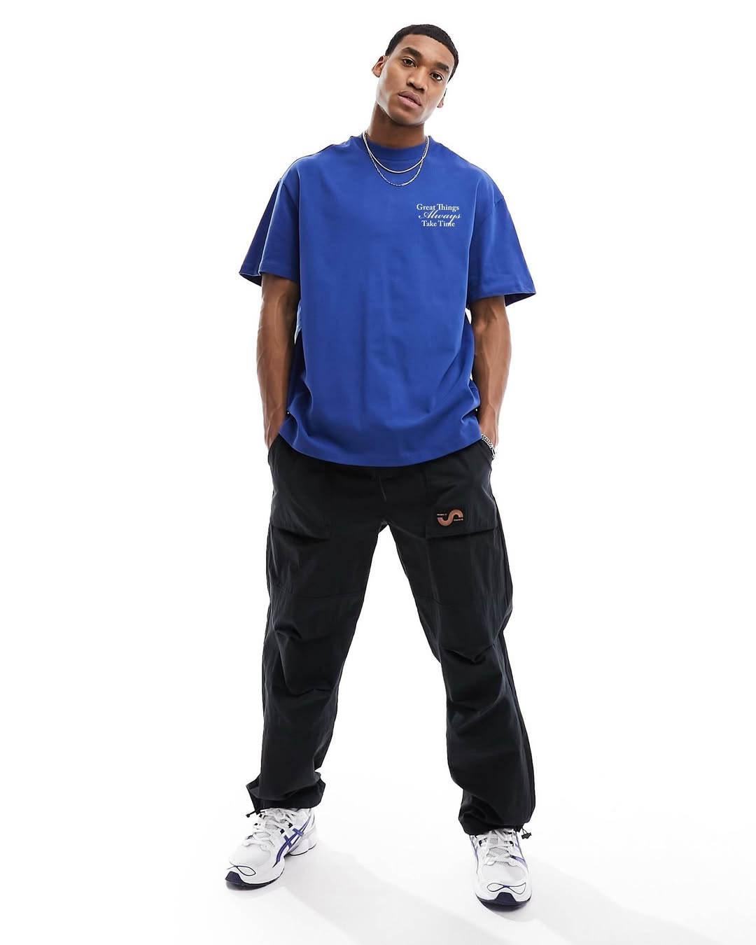 Blue oversized crewneck graphic T-shirt worn by model, short sleeves