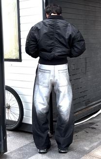 Fade-wash denim jeans, wide-leg fit with dark side panel accents and knee seams