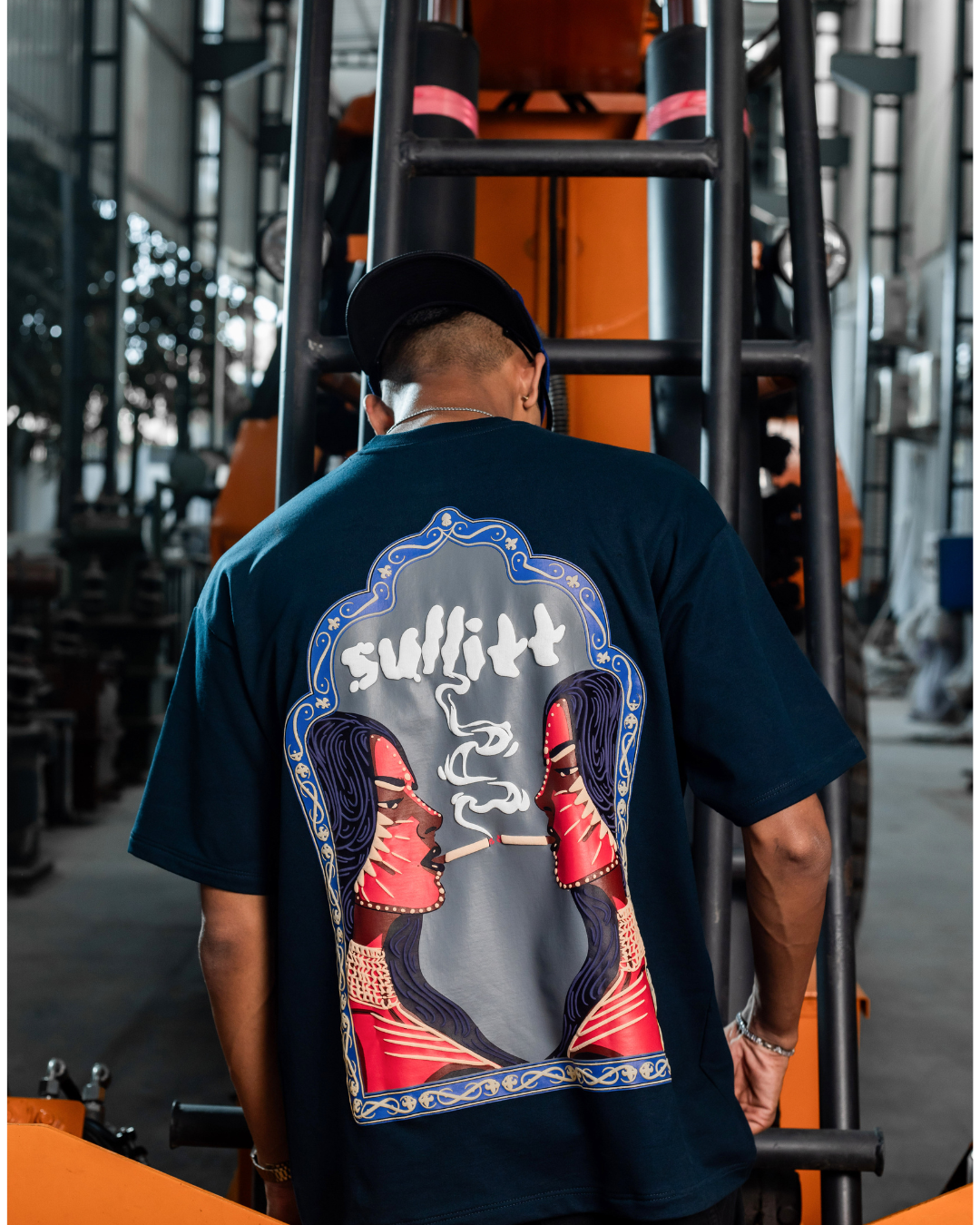Dark navy T-shirt with large back graphic of a woman and stylized text