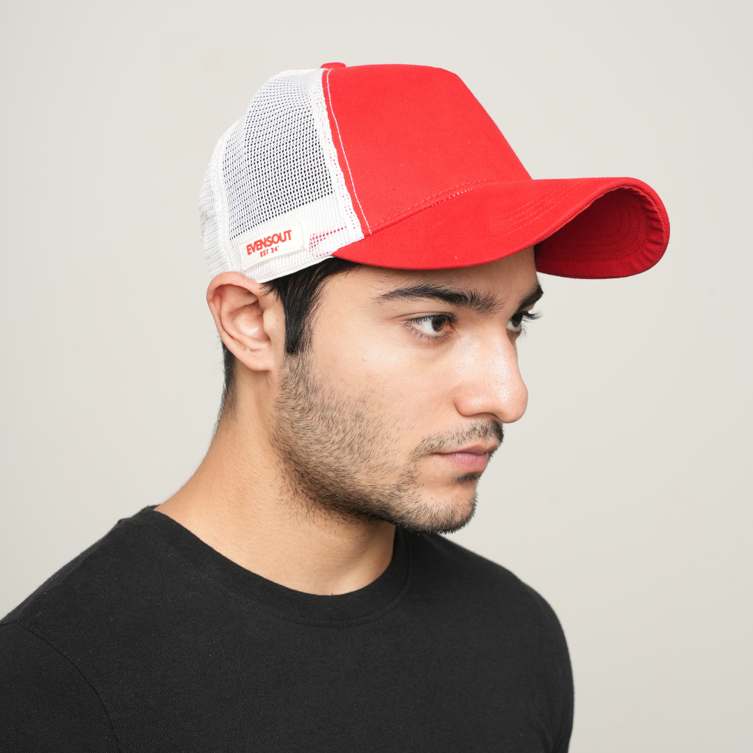 Red front and white mesh baseball cap, side profile with logo patch