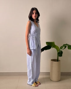 Light blue sleeveless wrap linen co-ord set with wide-leg trousers