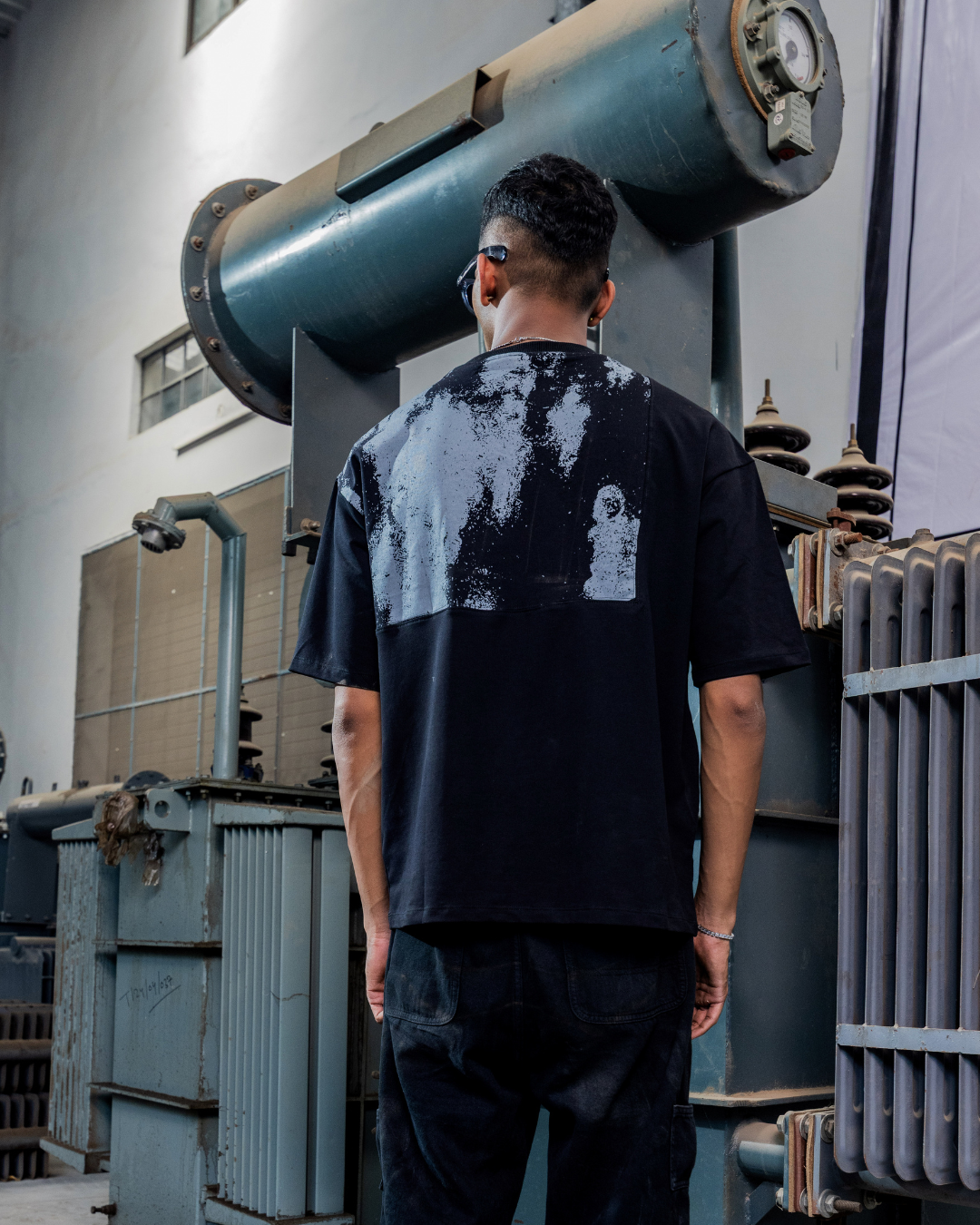 Angel Grey patch T-shirt, black crewneck with large white paint-splatter back graphic