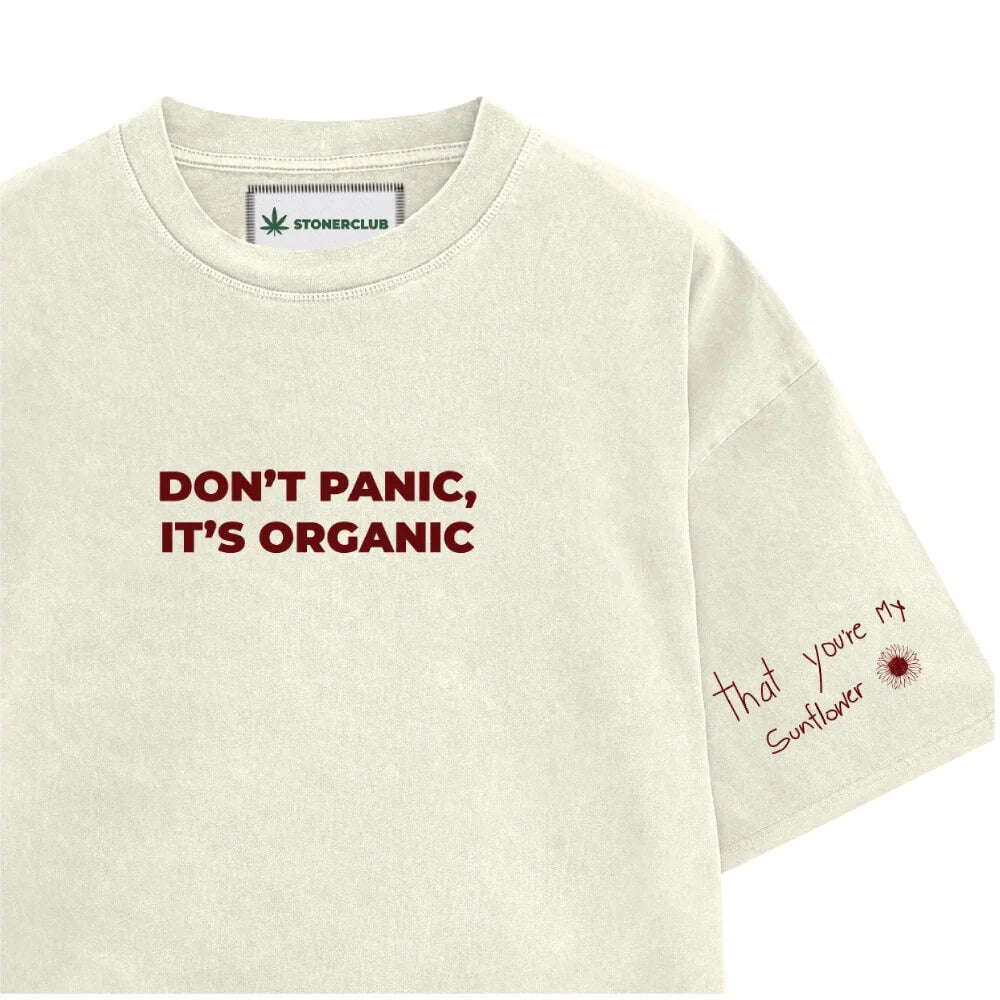 Off-white T-shirt with 'DON'T PANIC, IT'S ORGANIC' and red flower text on sleeve.