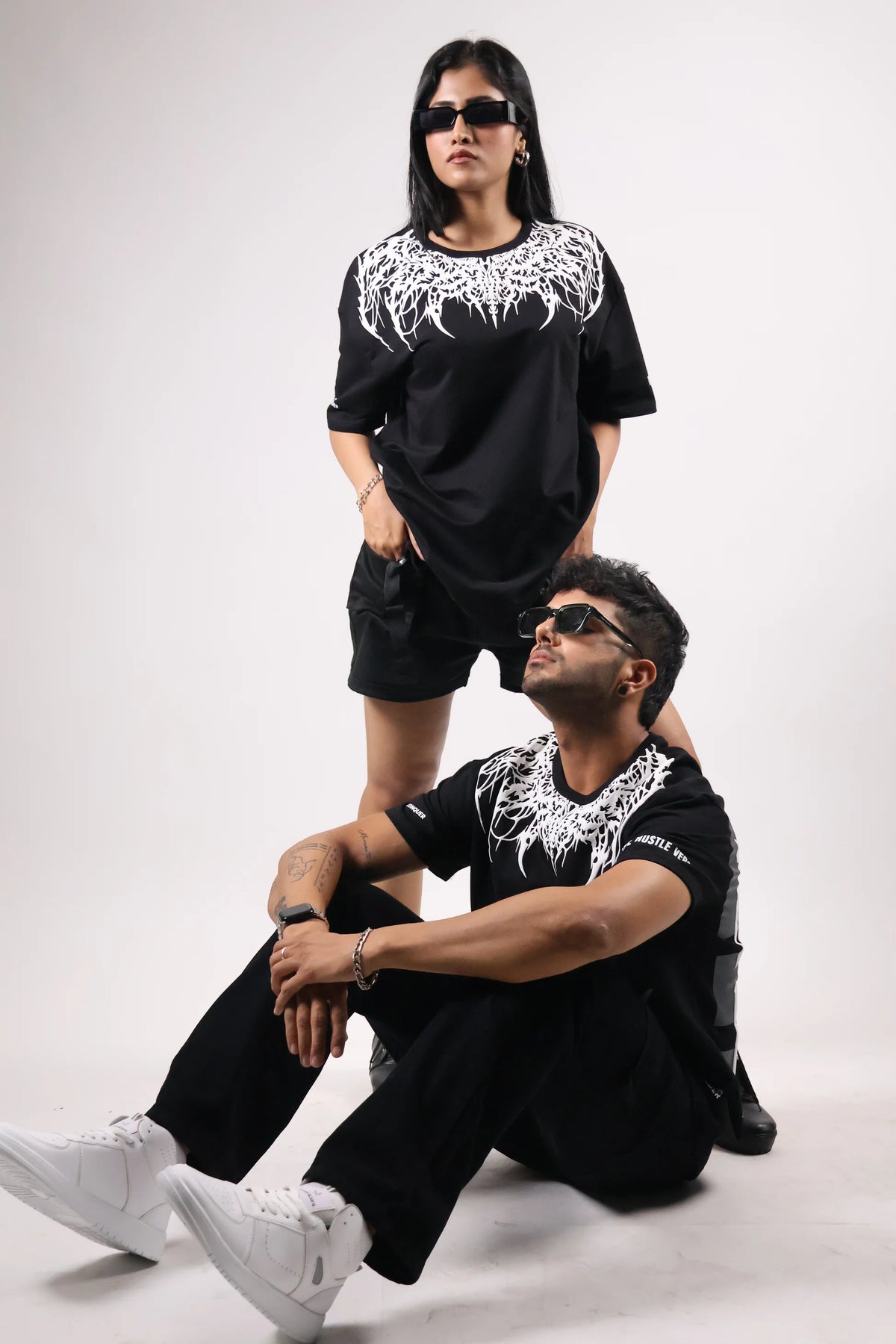 Oversized black T-shirt with white dripping crown graphic and crew neck