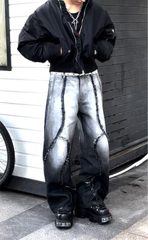 Fade-wash denim jeans with wide legs and dark stitched side panel detailing, front view