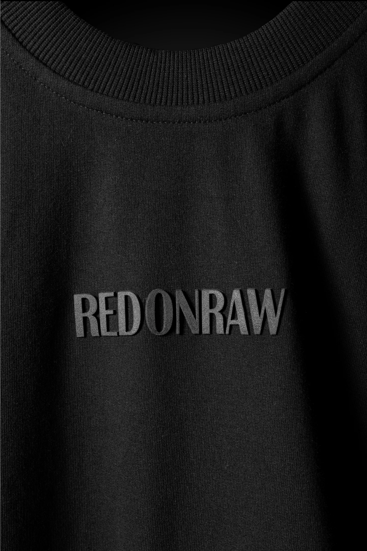 Black T-shirt with large 'REDONRAW' chest lettering