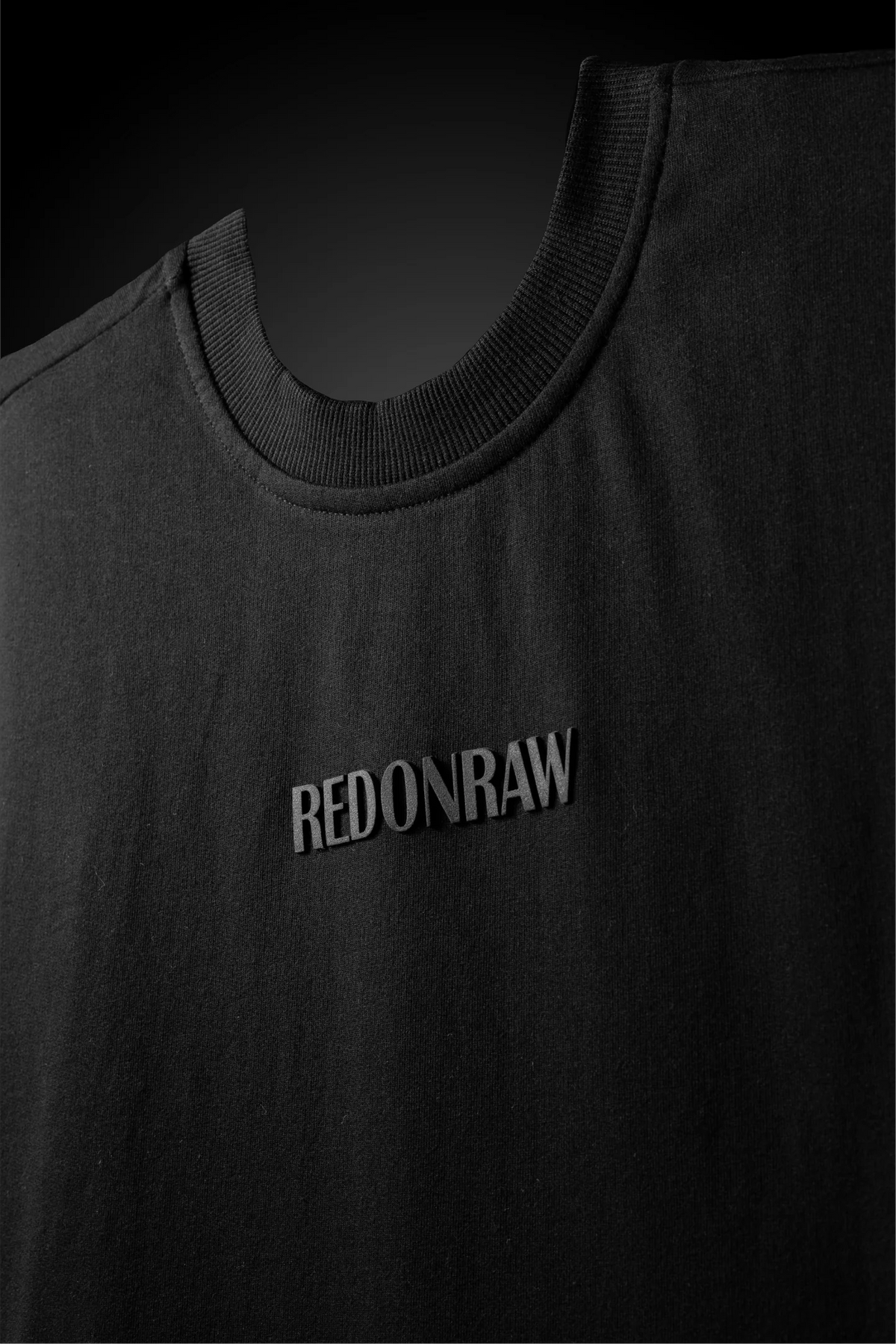 Black crewneck T-shirt with 'REDONRAW' front print