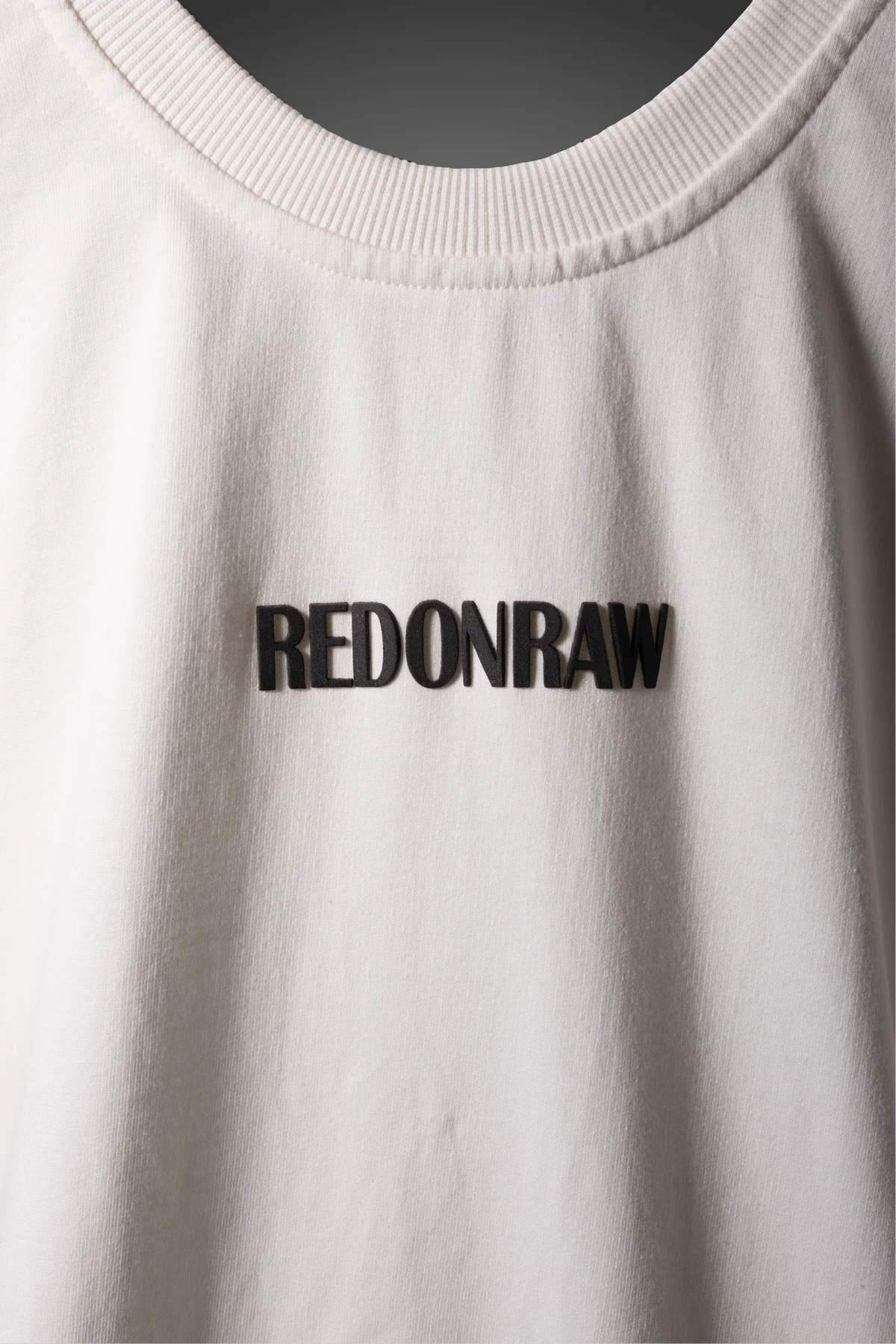 White crew-neck T-shirt with REDONRAW wordmark logo on front