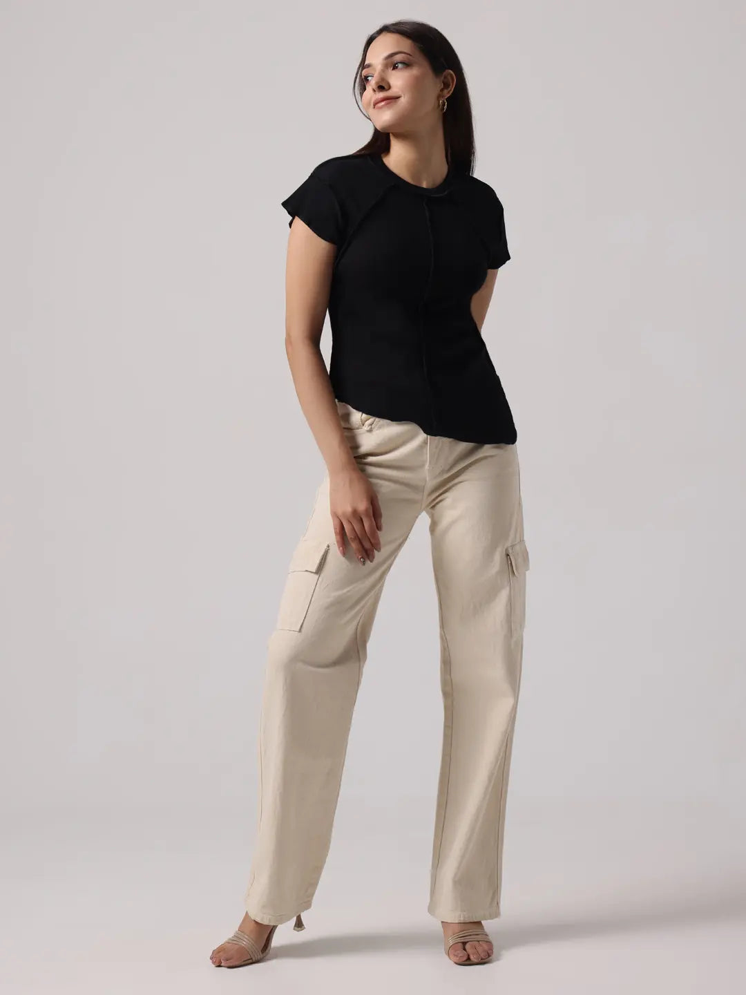 Black cap-sleeve top with round neckline and curved exposed-stitch center seam