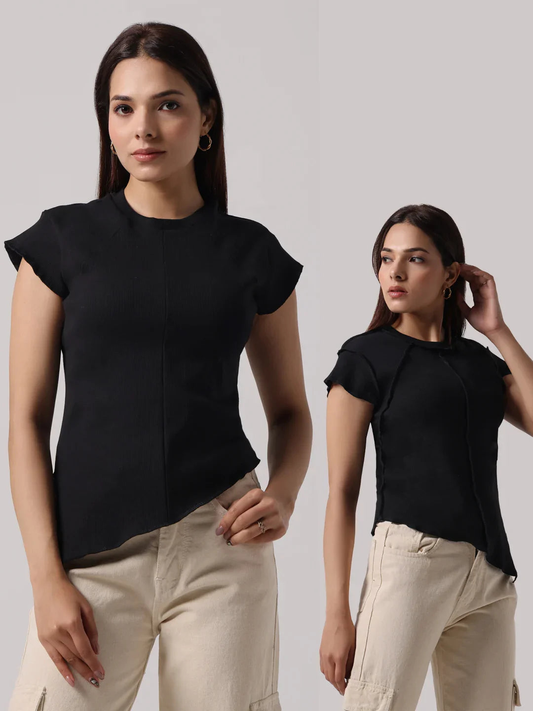 Black cap-sleeve top with front exposed stitching and short asymmetrical hem