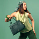 EMERALD ELEGANCE POISE HANDBAG STROKES GALLERY