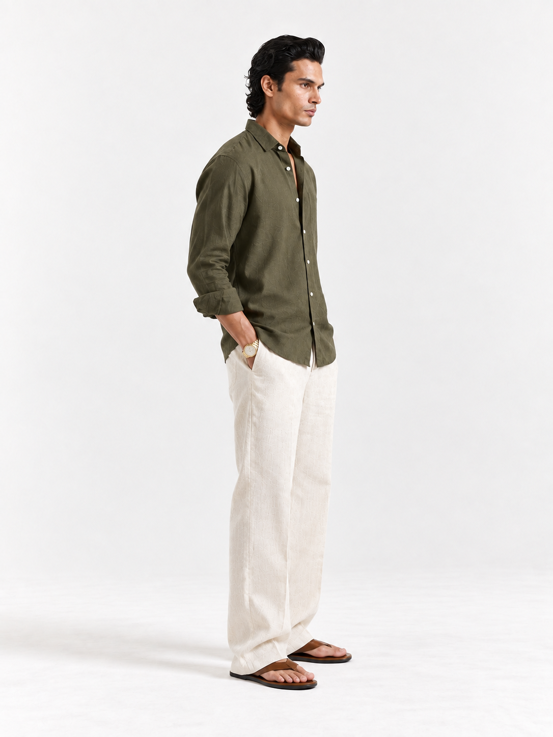 Olive linen button-up shirt with long sleeves and curved hem