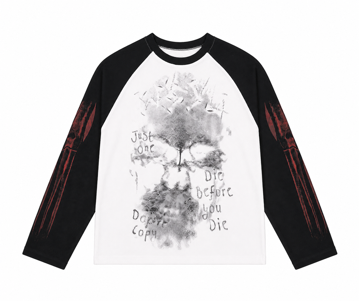 Black and white raglan waffle long-sleeve shirt with distressed front graphic.