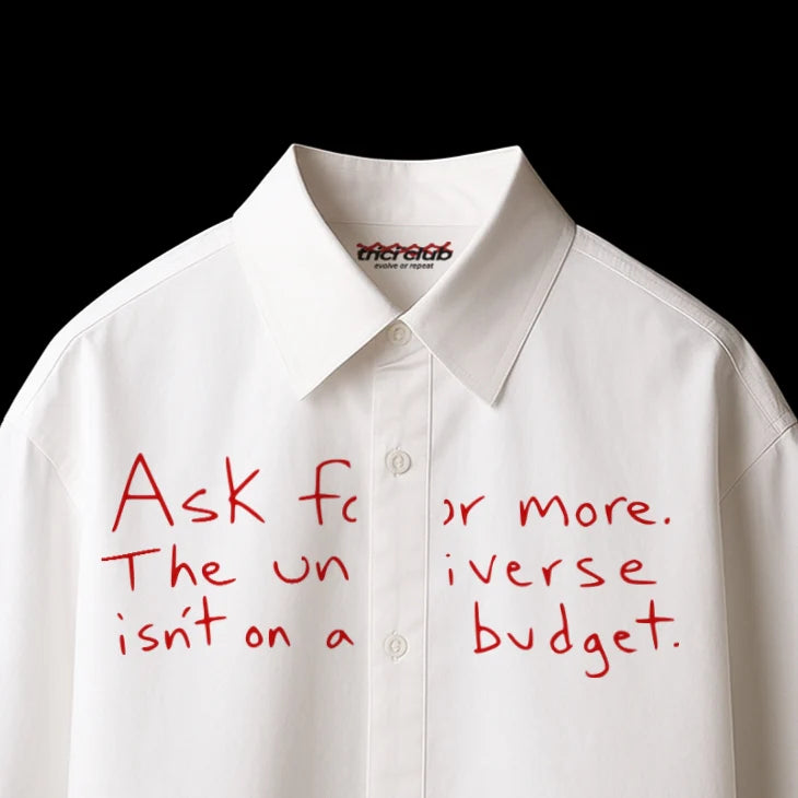 White boxy-fit button-up shirt with red text graphic on front