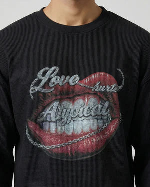 Black crewneck sweatshirt close-up of red lips graphic with cursive Love text