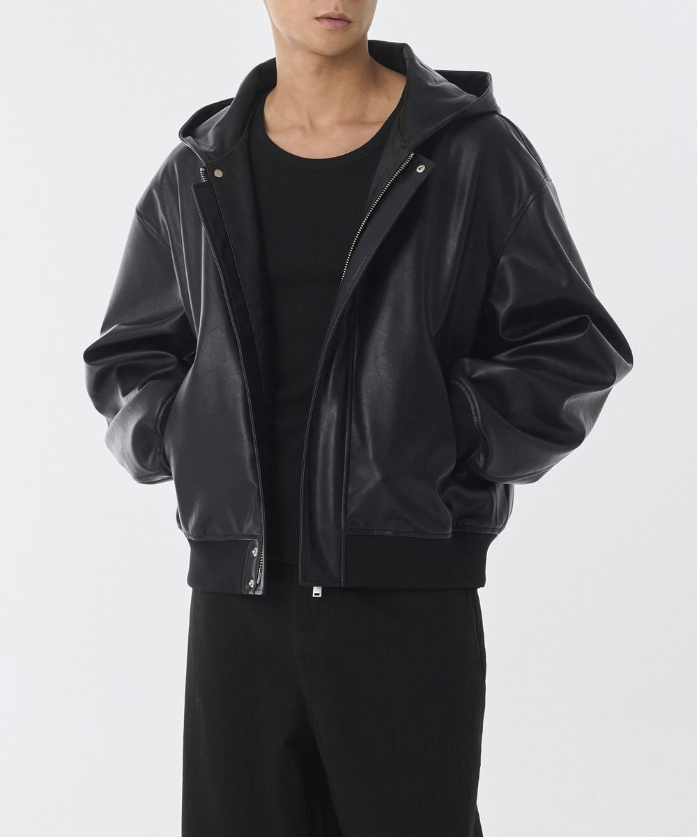 Black hooded zip jacket with snap pockets and adjustable cuffs