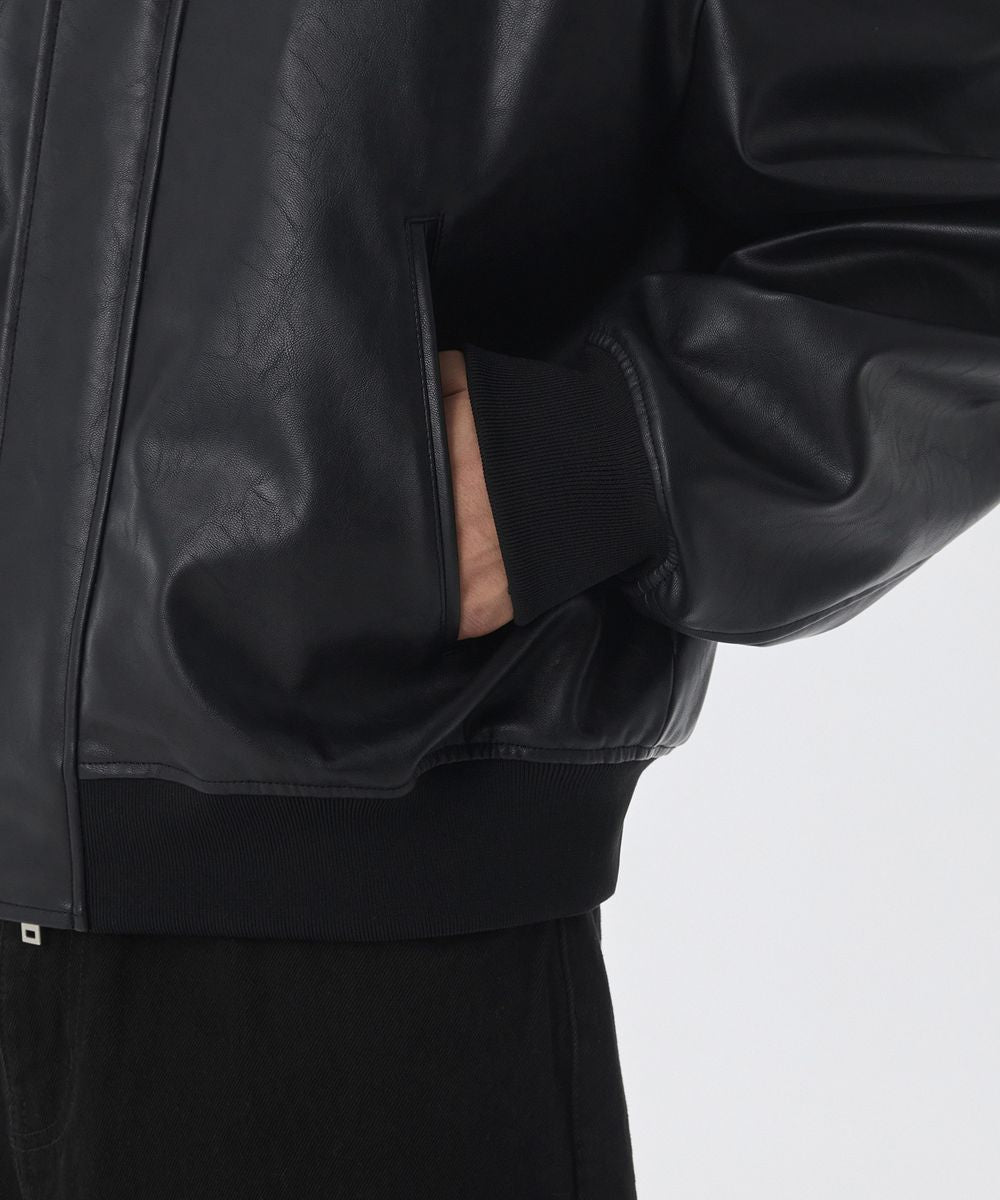 Dark hooded jacket with ribbed cuffs and zip front, side view sleeve and hem