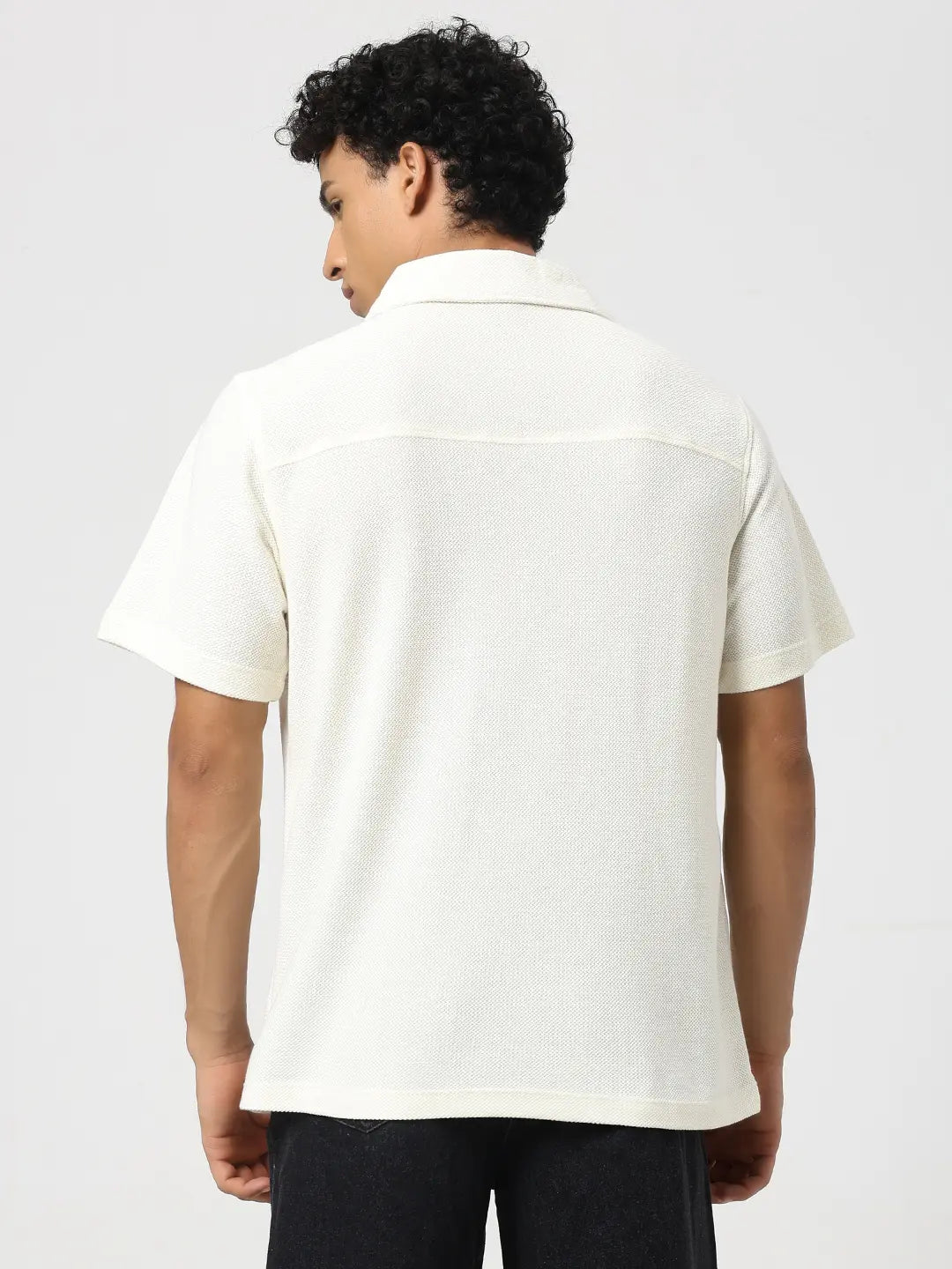 Ivory textured bowling shirt from the back with short sleeves and open collar