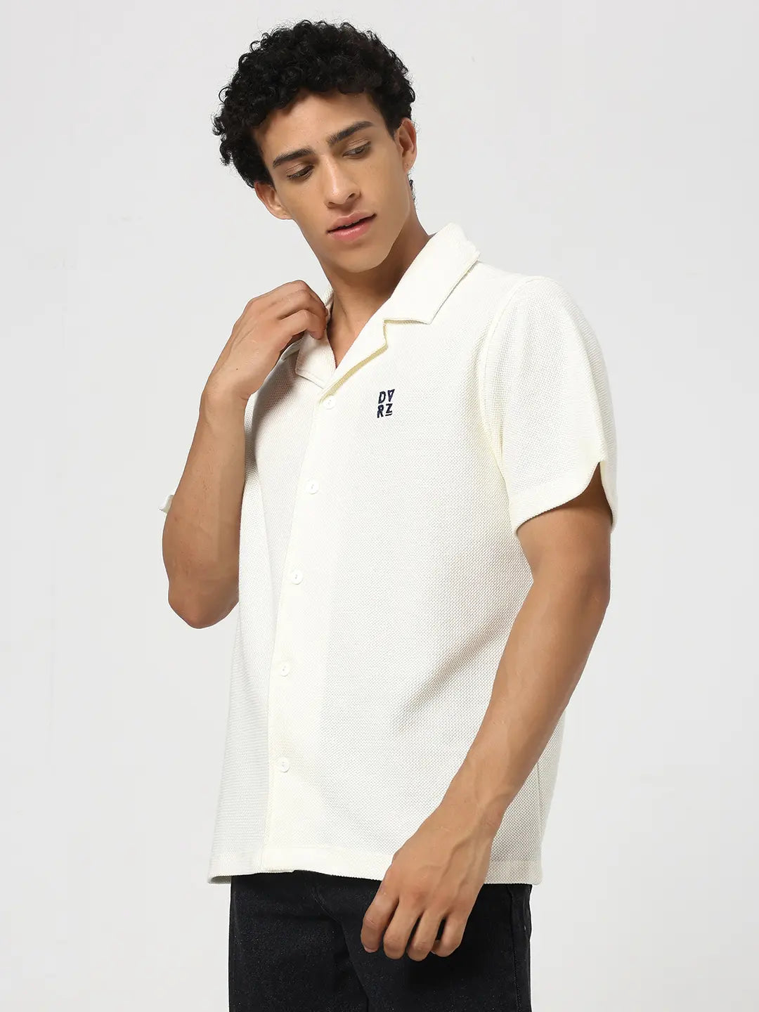 Ivory textured bowling shirt with open collar, short sleeves, and button-front