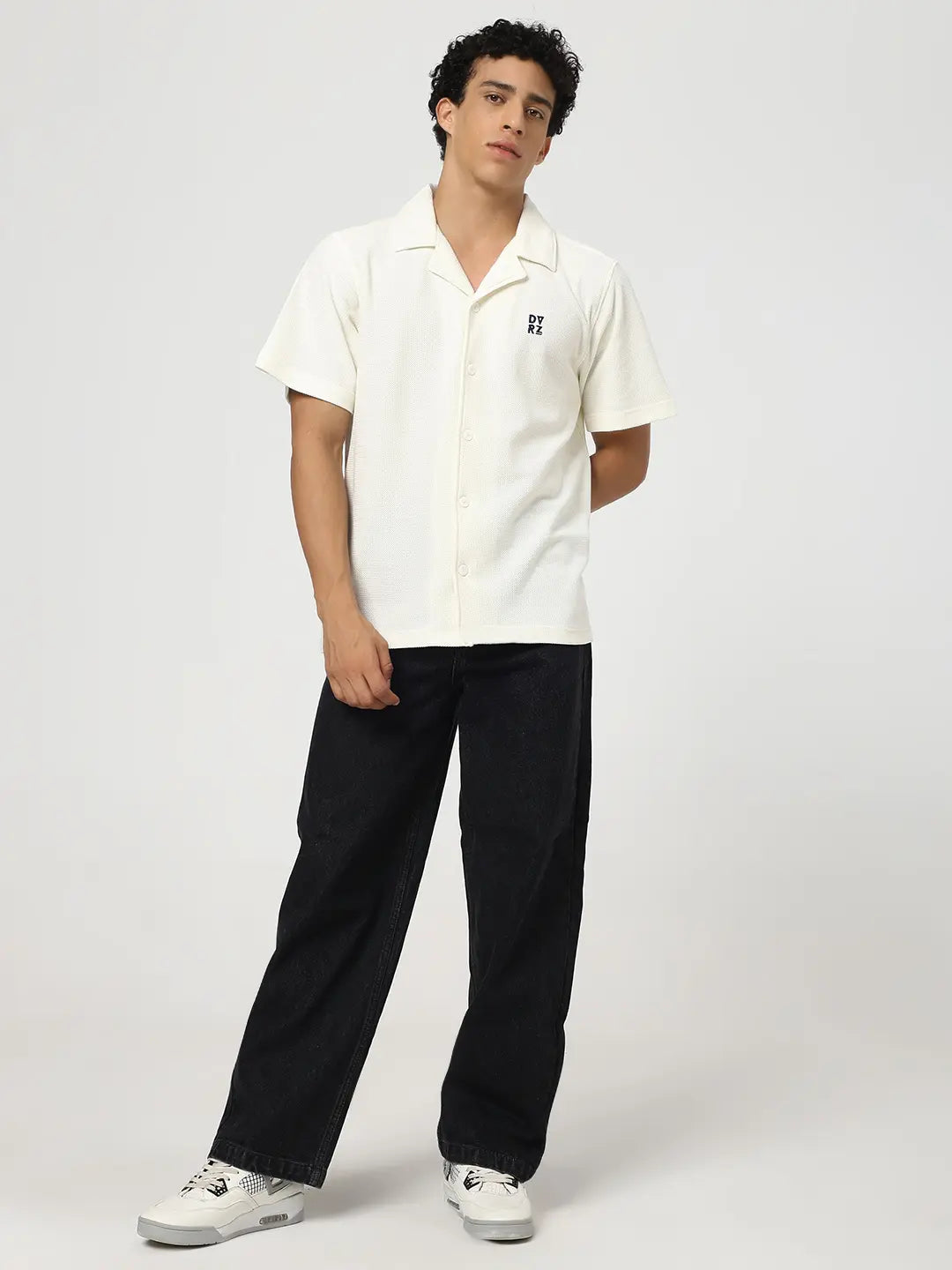 Ivory textured bowling shirt on model, front view with short sleeves and chest logo