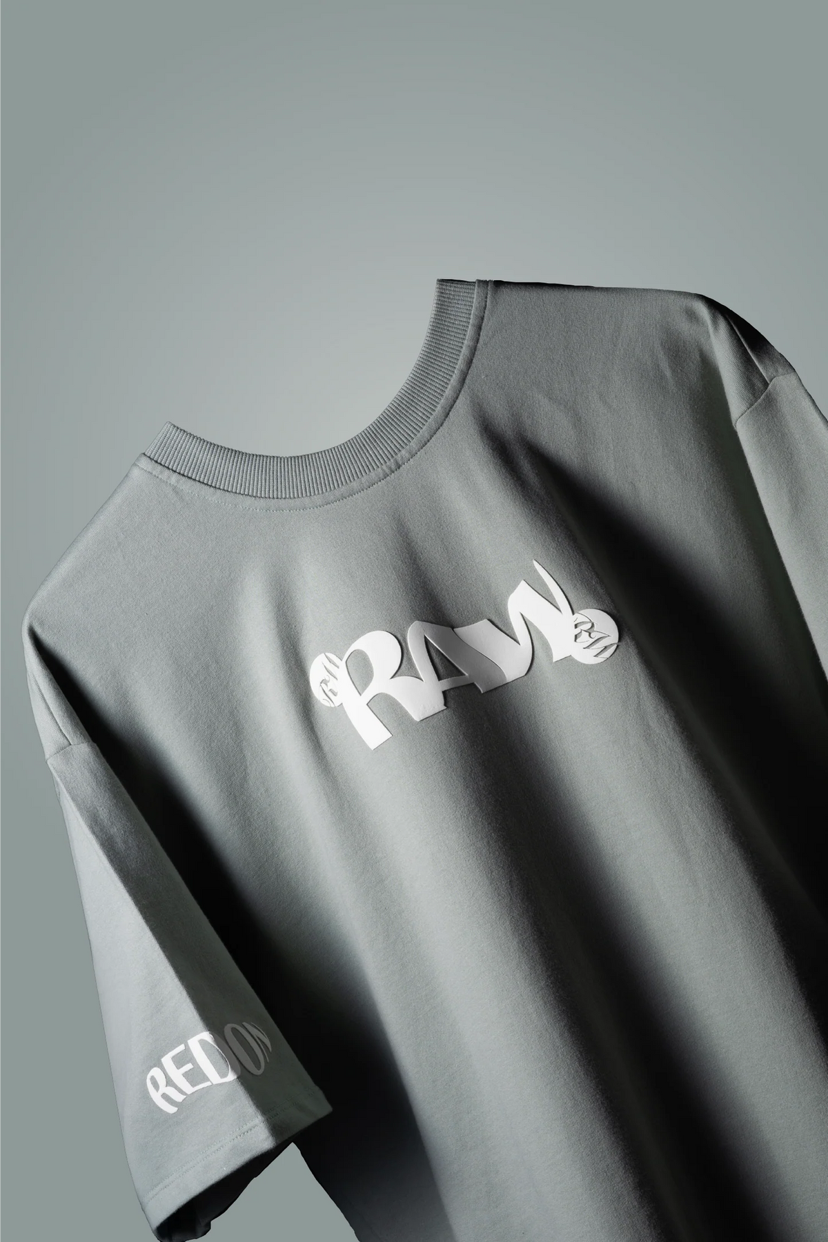Mint green crew-neck T-shirt with white 'RAY' logo and 'RED ON' on sleeve