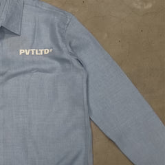 Light blue linen shirt with short sleeves and PVTLTD logo on chest