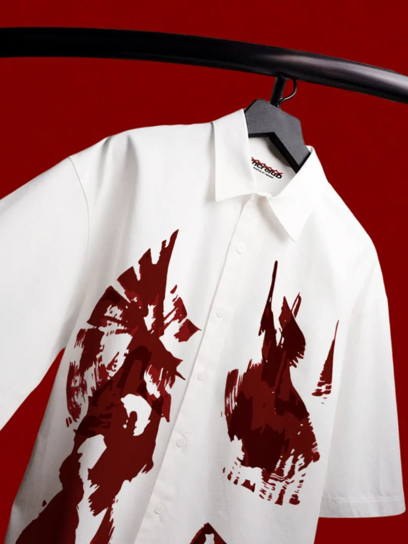 White boxy short-sleeve button-up shirt with red graphic print front close-up
