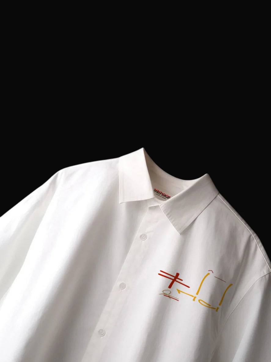 White boxy fit shirt with pointed collar, button placket, multicolor logo graphic on chest.