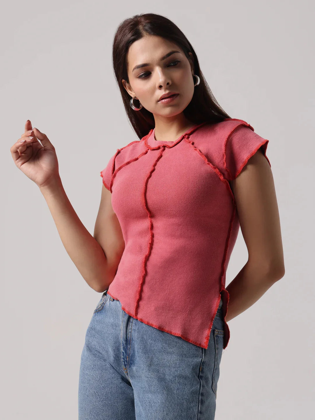 Rose-pink reversible exposed-stitch top with short sleeves and round neckline