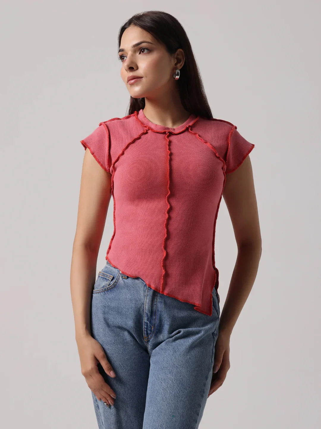Rose-pink exposed-stitch top with round neckline and short cap sleeves, front view