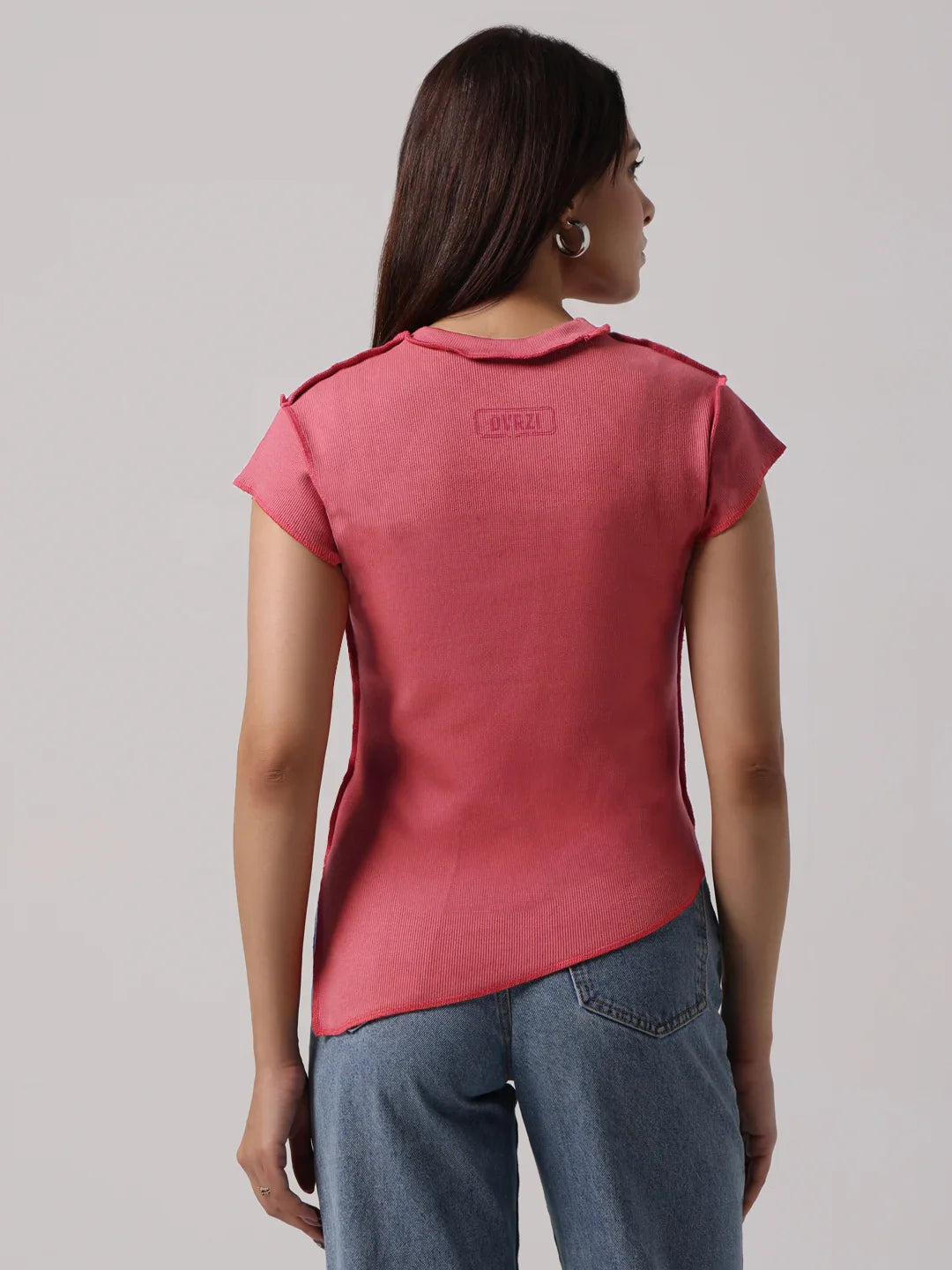 Rose-pink top viewed from back with short sleeves and exposed seam detailing