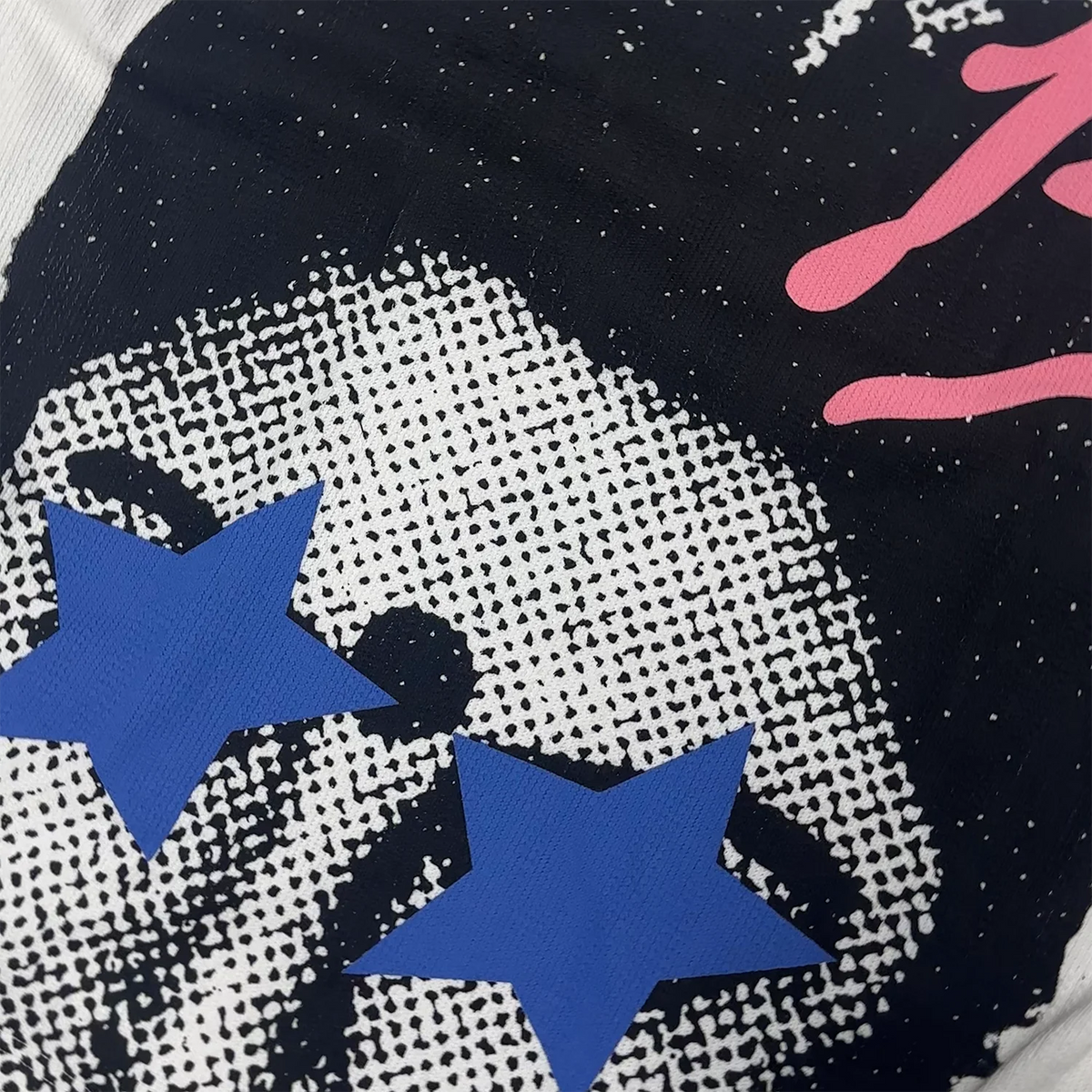 Blue star print on dark graphic front of white long-sleeve T-shirt