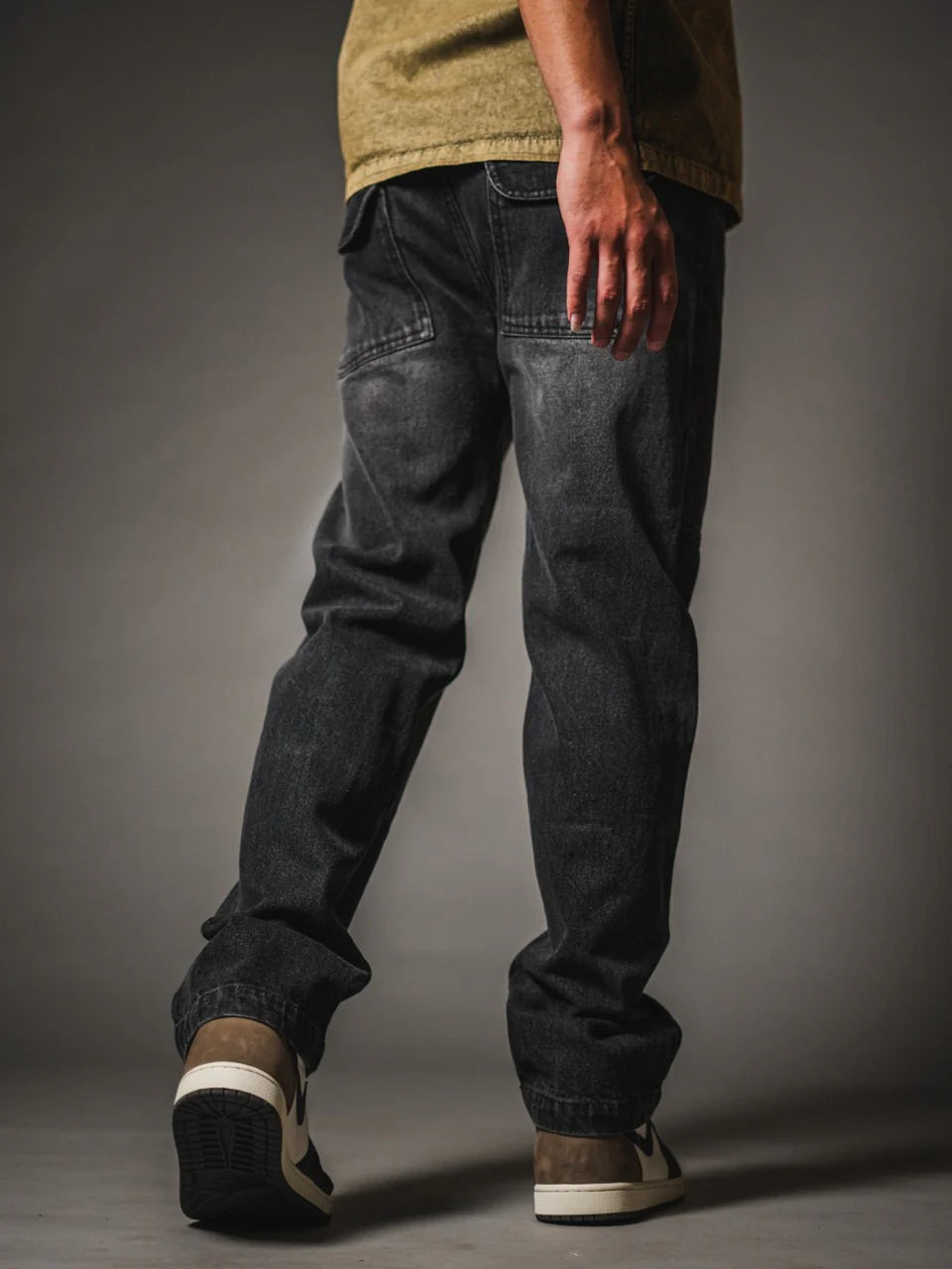 Loose fit dark gray jeans with paneled knees and relaxed straight leg