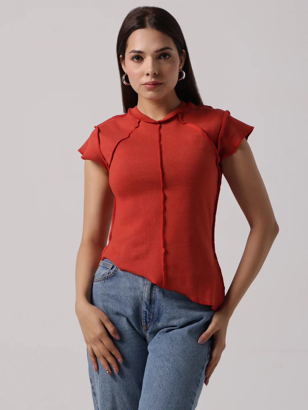 Red cap-sleeve blouse with stand collar and exposed center-front seam, fitted style