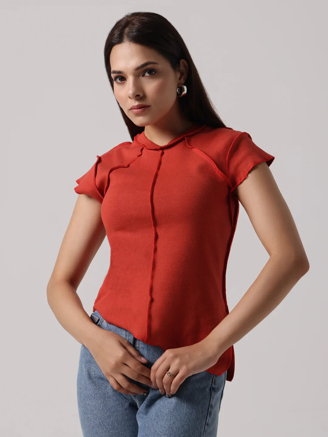 Red cap-sleeve blouse with stand collar and exposed center-front seam stitching