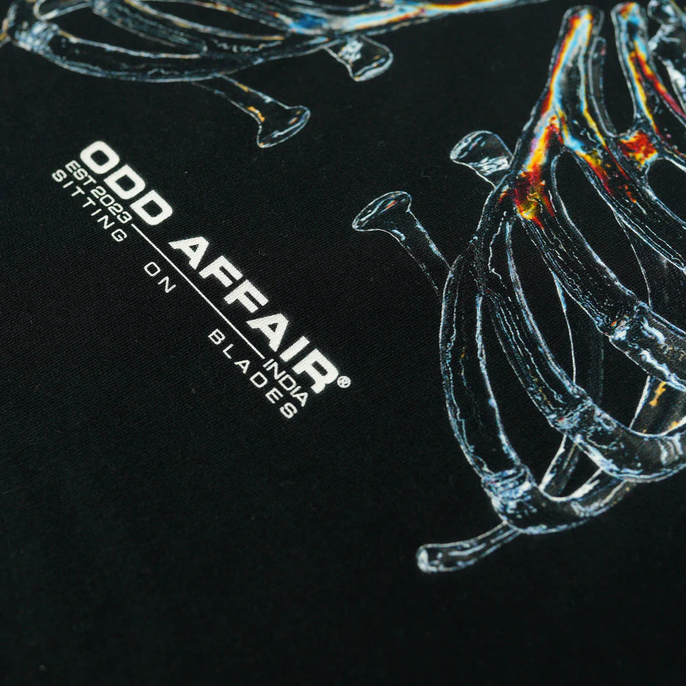 SITTING ON BLADES T-SHIRT