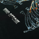 SITTING ON BLADES T-SHIRT ODD AFFAIR
