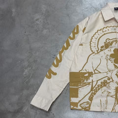 Off-white long-sleeve button-up shirt with gold line-art print and pointed collar