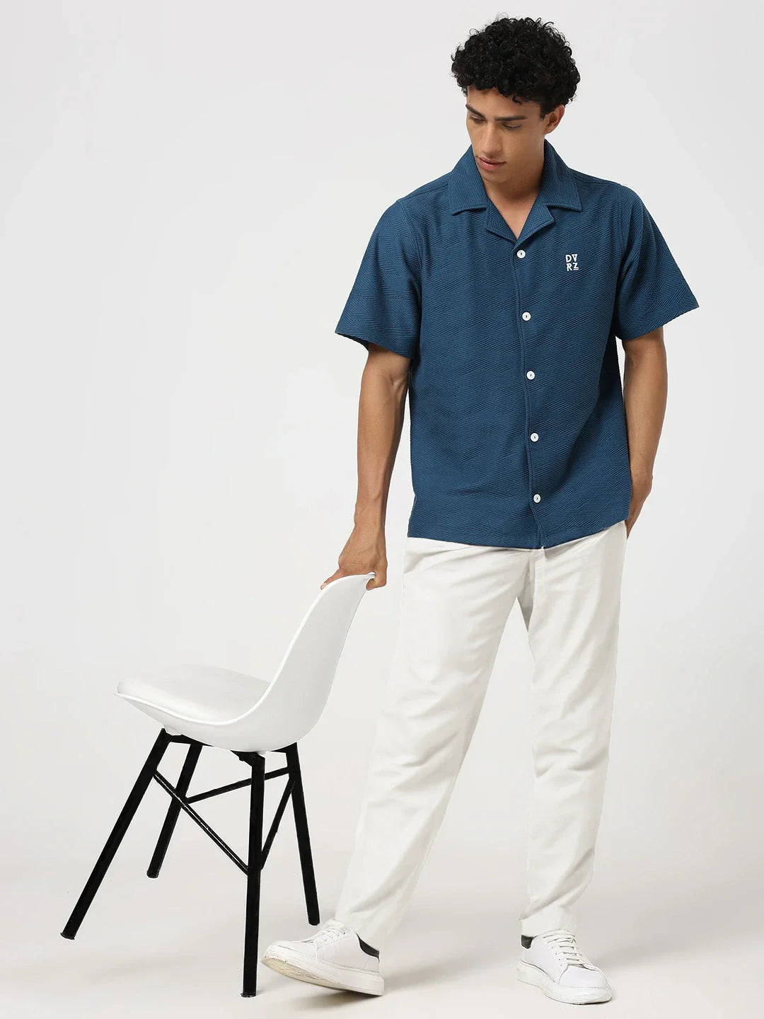 Blue textured bowling shirt with short sleeves, button-front placket, pointed collar