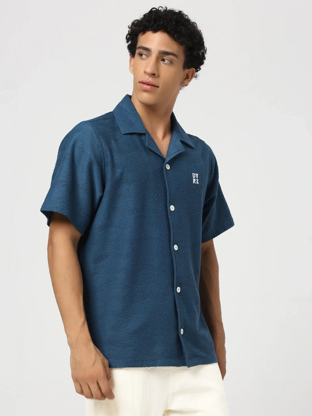 Blue textured bowling shirt with short sleeves, button front, pointed collar